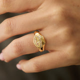one-of-a-kind fancy yellow marquise diamond curve ring in 14K gold with white diamond pavé and hand-carved gold facets on hand