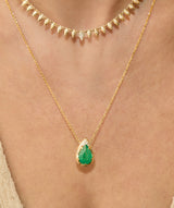 mystic emerald necklace Pear-cut natural emerald drop with hand-carved textured 14K yellow gold setting and delicate gold chain worn on neck