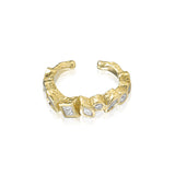 modern gold diamond ear cuff worn on ear layered styling
