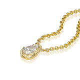 • sculptural gold frame pendant with pear shaped diamond