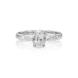Front view of 1 ct natural oval-cut diamond engagement ring with textured 14K white gold band.