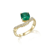 sculptural emerald ring with pavé diamonds and flowing gold band