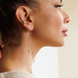 Tyra Topaz chain earring in 14K gold with bezel-set diamonds