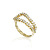 Angled view of thin natural diamond infinity ring with 0.75 ct of diamonds and sculptural textured 14K yellow gold.