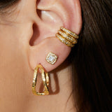Diamond stud earrings with princess-cut diamonds and organic textured