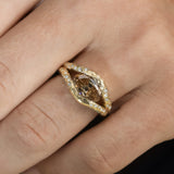 Discover the Annette Ring, featuring a 2 ct oval champagne diamond set in a luminous diamond halo. An alternative engagement ring handcrafted in 14K gold.