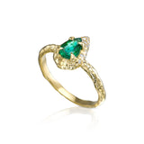 Mystic ring with 0.70 ct pear-shaped natural emerald, diamond detailing and hand-carved textured 14K yellow gold band.