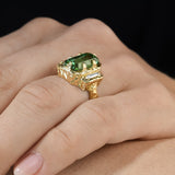 Side view of lagoon tourmaline and baguette diamond ring showing the hand-carved 14K yellow gold setting.