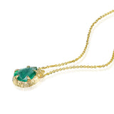 Pear-cut natural emerald drop necklace with hand-carved textured 14K yellow gold setting and delicate gold chain.