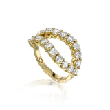 Angled view of bold natural diamond infinity ring with 2 ct of diamonds and sculptural textured 14K yellow gold.
