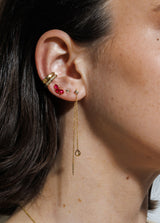 14K gold Venus earring featuring a pear-shaped white topaz charm, diamond stud detail, and graceful single chain drop.
